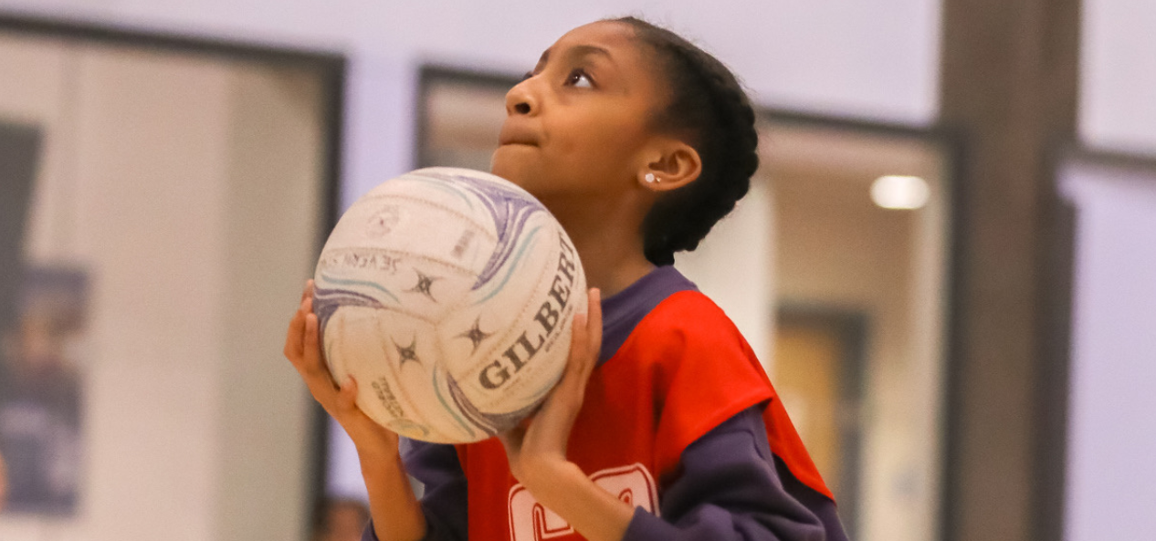 Girl holding a netball