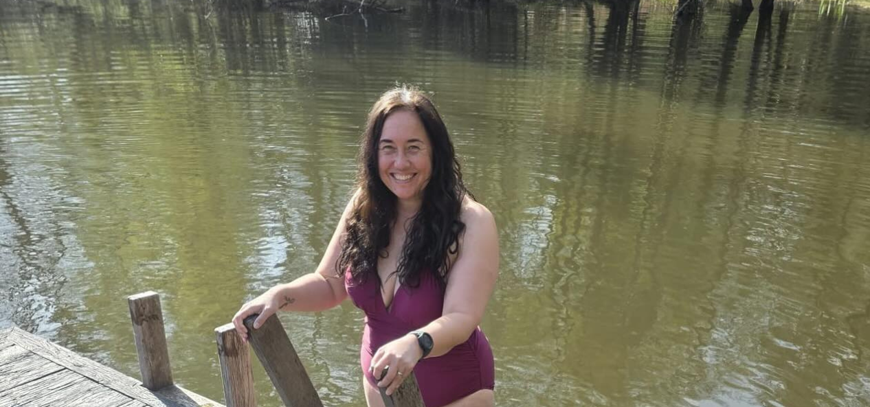Woman coming out of lake