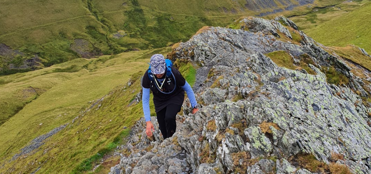 Woman climbing rock