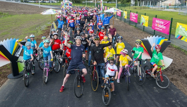 group of cyclists waving