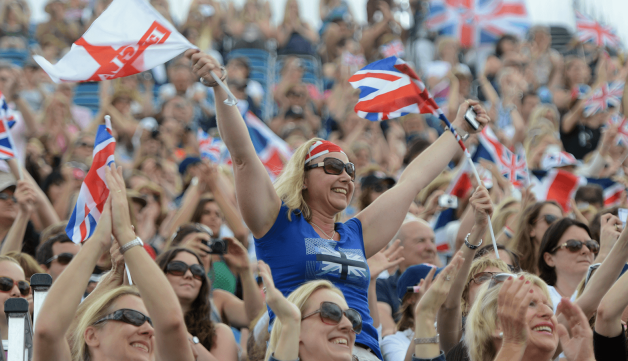 Audience cheering waving England flag