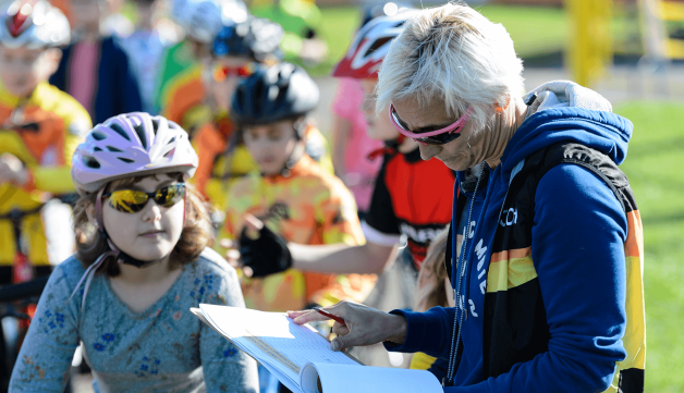 children signing up to a cycling event