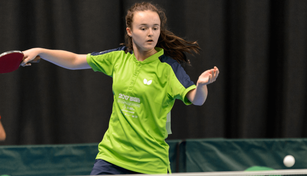 Girl playing indoor table tennis