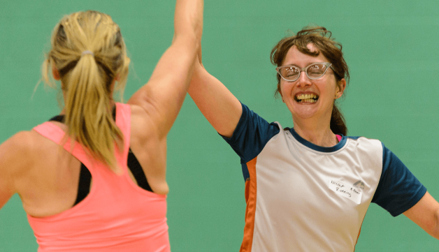 Two women high fiving during game