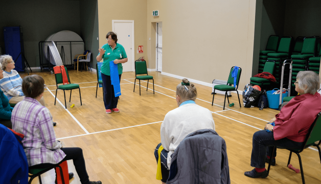 Volunteering group class seated in circle