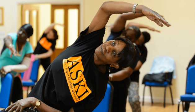 Woman stretching at exercise class