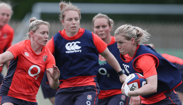 Women playing rugby outdoors 2