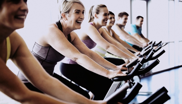 I Will If You Will - women on exercise bikes