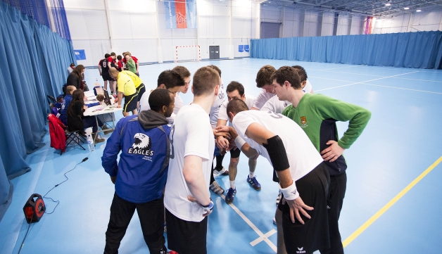 handball players gathered in a circle