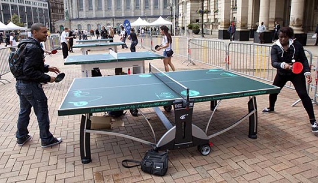 Two people playing table tennis