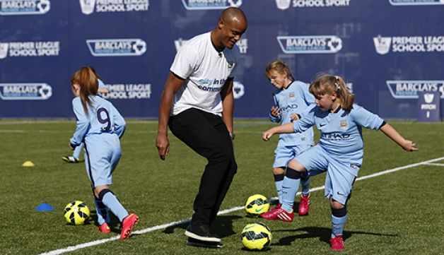 Girls playing football