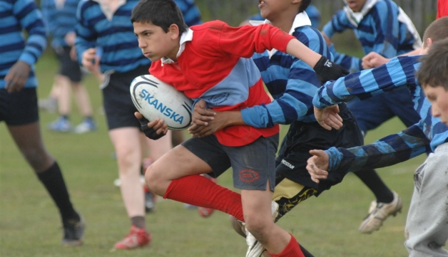 Rugby boy being tackled