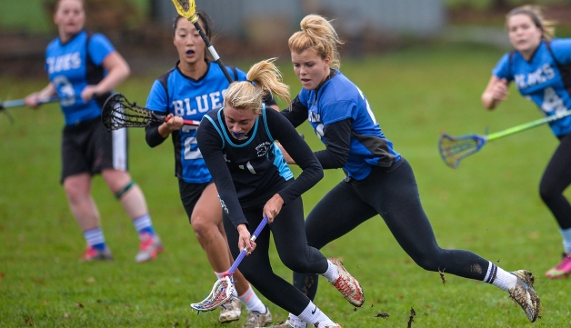 women playing lacrosse