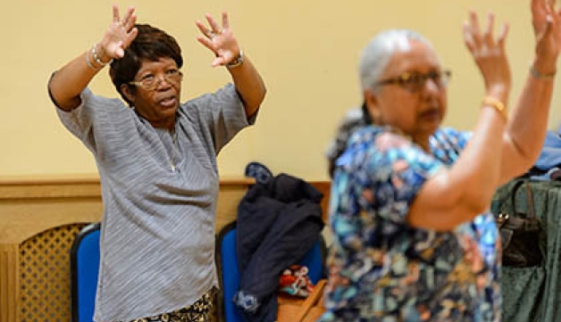 Two women doing a stretching exercise.