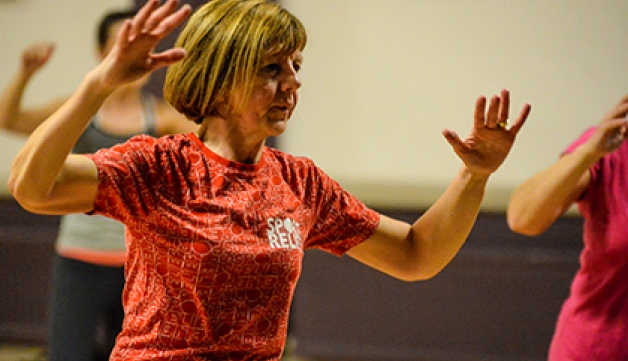 A woman exercising in a class.