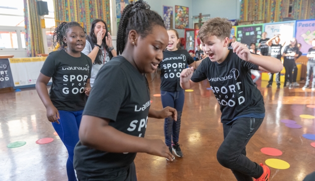 Primary school children in Nottingham take part in the Laureus Sport for Good project by getting active in a school hall