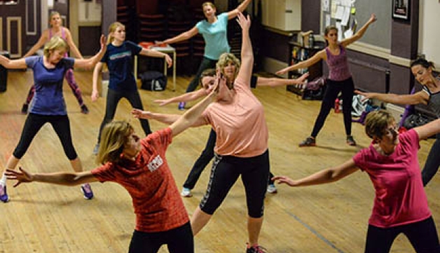 A group of women taking part in a health and exercise class.