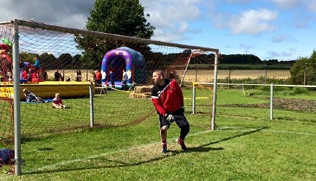 A man plays football at Forest Hall Young People’s Club in North Tyneside 