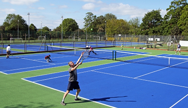 Tennis players on hard courts, after coronavirus restrictions are eased