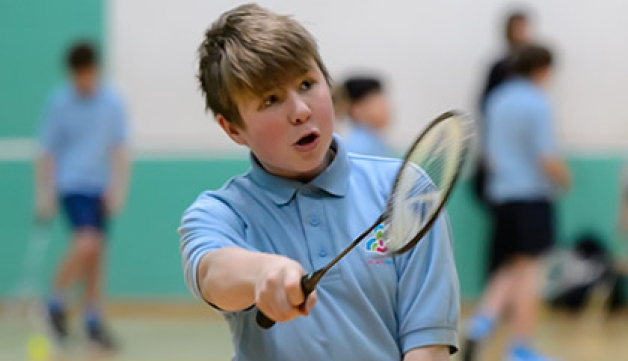 A boy playing badminton
