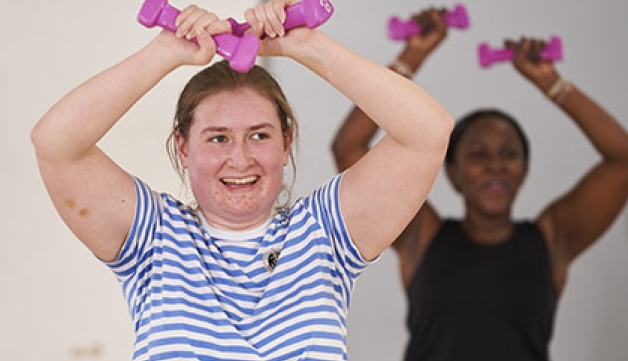 Two women working out at the gym