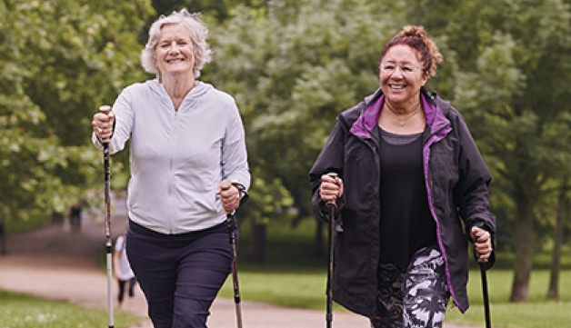 Two women going for a walk in the park