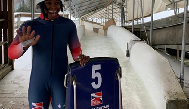 Skeleton slider Taiwo Eyiowuawi smiles and waves at the bottom of the skeleton run in Lillehammer