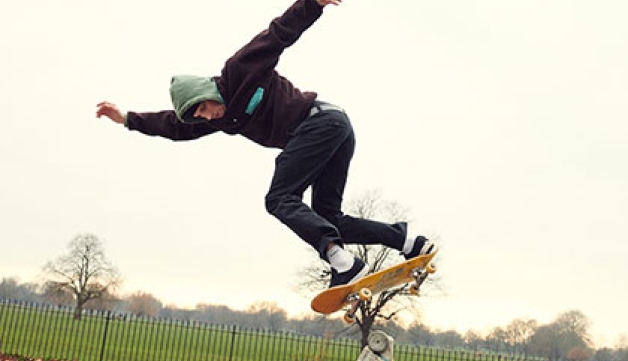 A man skateboarding in the park