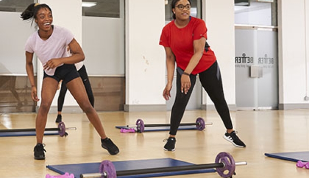 Two women working out in a fitness class