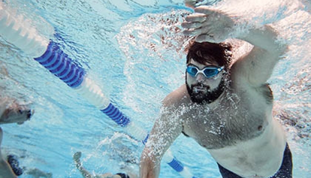 A man swimming in a pool