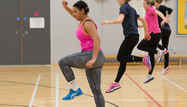 People jumping in an exercise studio