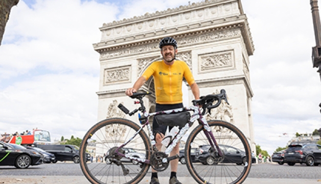 Sport England chair Chris Boardman poses with his bike in front of the Arc de Triomphe at the end of the Pedal for Paris ride,