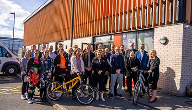 A group shot outside Leigh Bike Library in Greater Manchester with, among others, Sport England chair Tim Hollingsworth, executive director of place Lisa Dodd-Mayne and GM Moving chief executive Hayley Lever