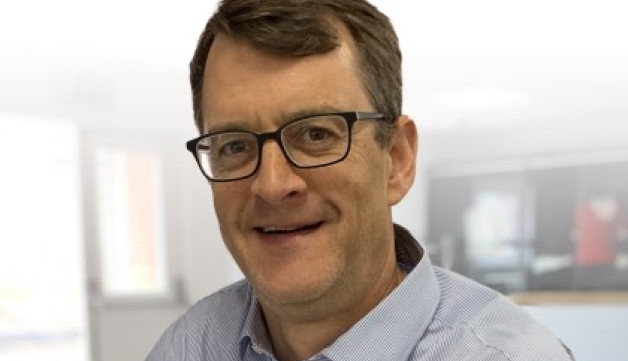 Headshot of Simon Hayes.