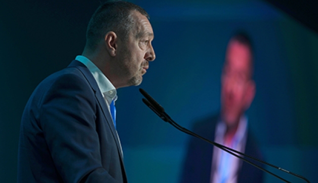 Chris Boardman speaks at a lectern during COP29 in Azerbaijan.