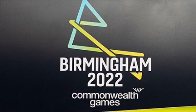 Birmingham 2022 Commonwealth Games logo over a black background, white font and yellow triangle at its base. 
