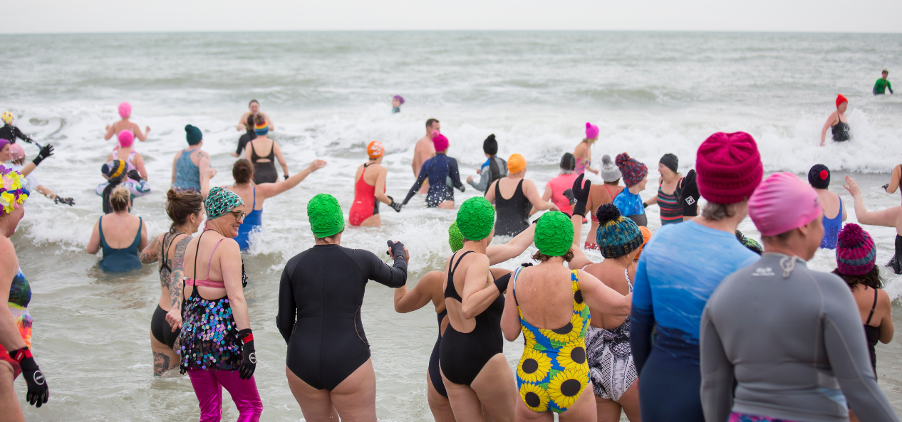 Group of women swimming in sea