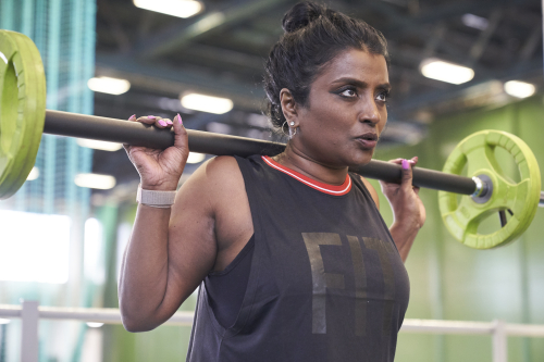 woman lifting a barbell