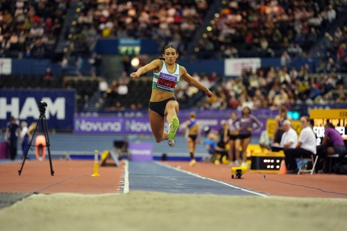 Head-on image of Georgina Forde-Wells completing the step phase of a triple jump at the UK Athletics Indoor Championships