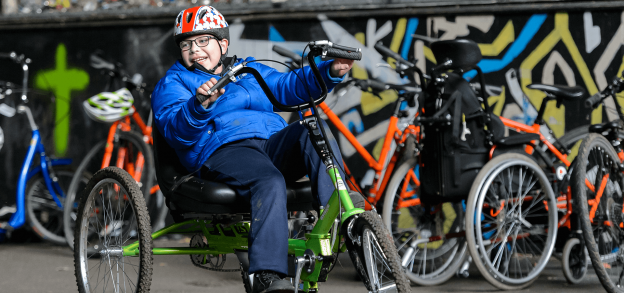 A boy riding a bike.