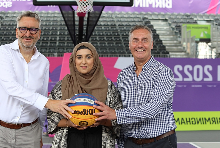Sport England CEO Tim Hollingsworth poses on the 3x3 basketball court at Birmingham 2022 with a representatives of Basketball England, Birmingham City Council