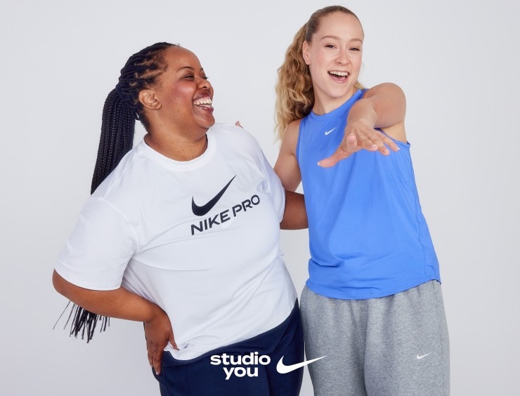 Two Nike Trainers laugh and point at the camera during a promotional shoot for Studio You.